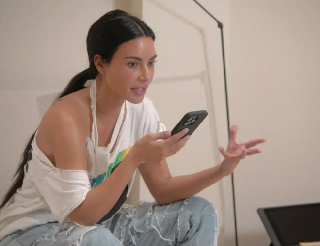 Kim Kardashian speaking on the phone with Kourtney Kardashian in the season four premiere of "The Kardashians." Hulu